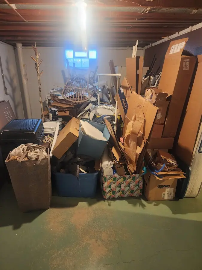 Roll-off dumpster container at job site for 2 Yard Dumpster Rental in Muskegon Heights